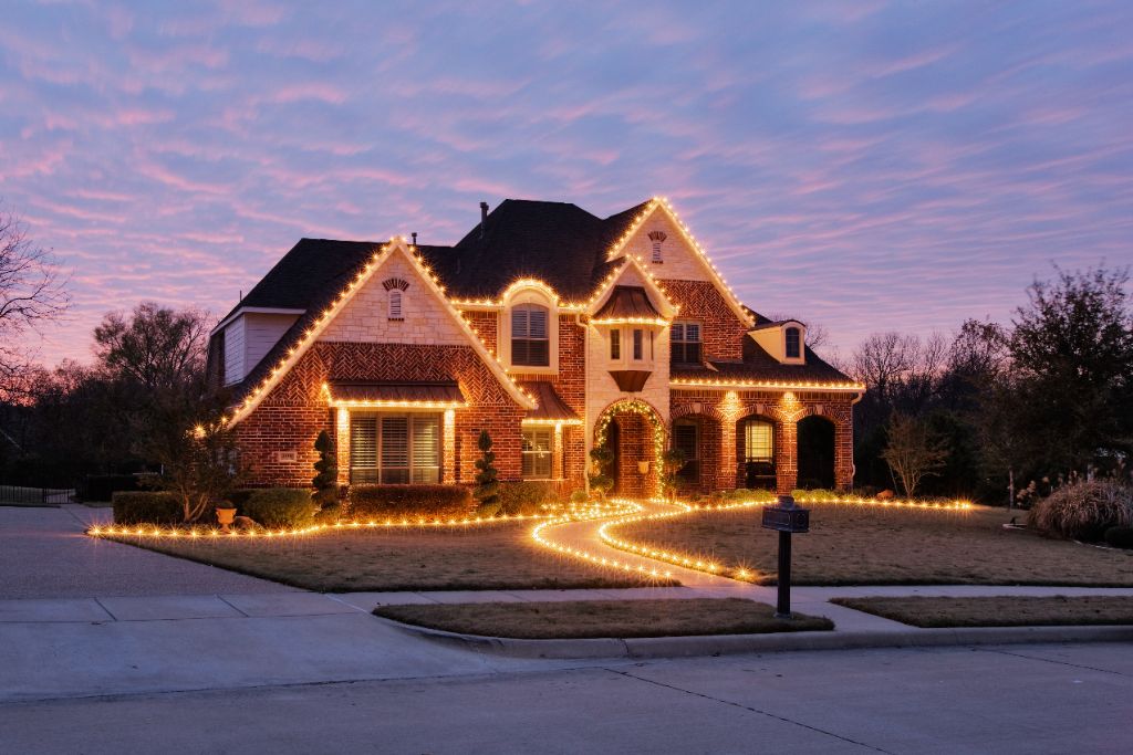 Home beautifully lit with Christmas lights